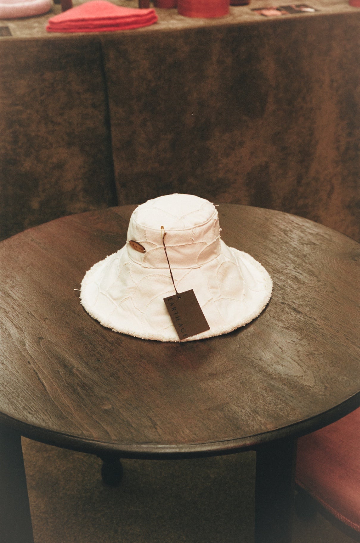 Earth Age hat on wooden table